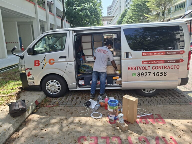 Electrician planning electrical rewiring in a Singapore home