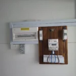 Best Volt incoming set with a new Cm consumer unit and isolator beside the timber SP Group meter board in a Singapore commercial unit.