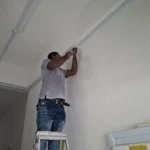 Best Volt applying sealant at a trunking joint above a Cm consumer unit during making good.